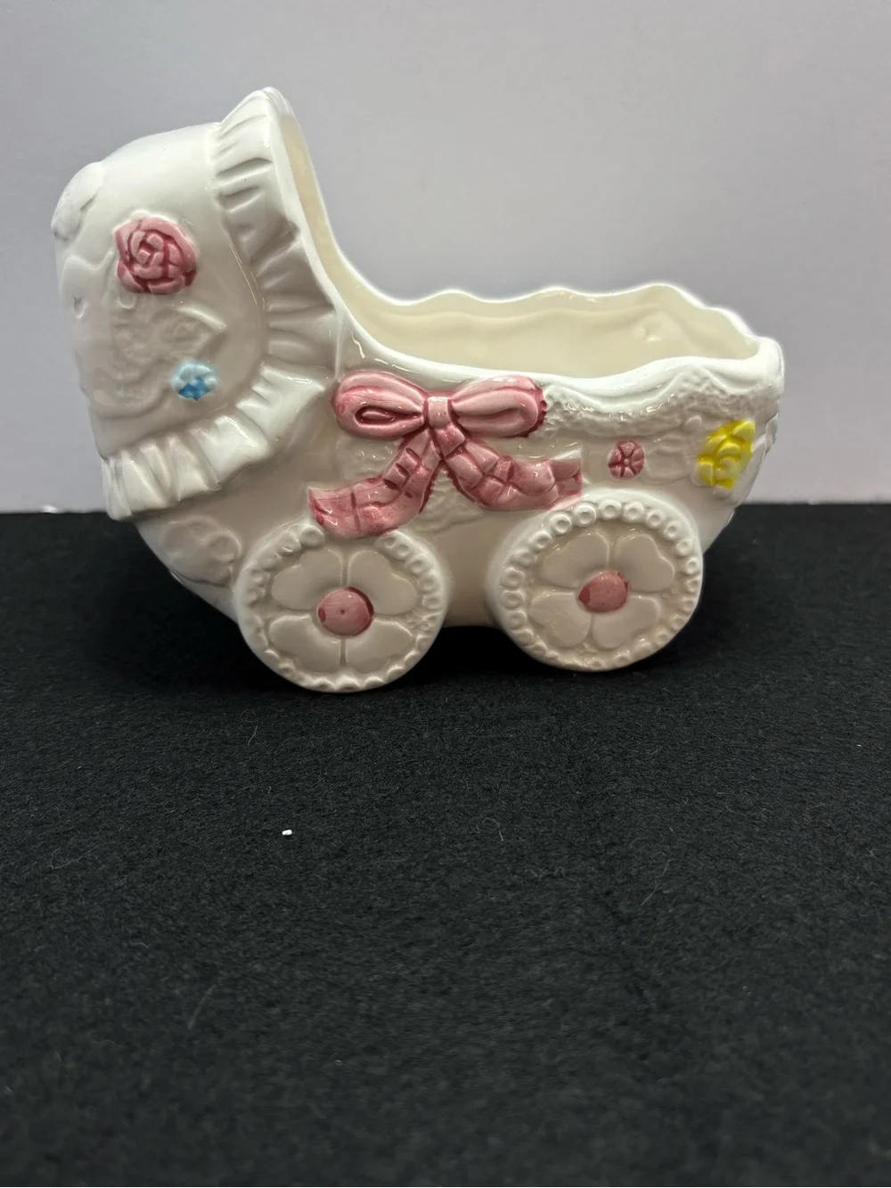 Glossy Ceramic Baby Carriage Planter in White with Pink, Blue & Yellow Accents